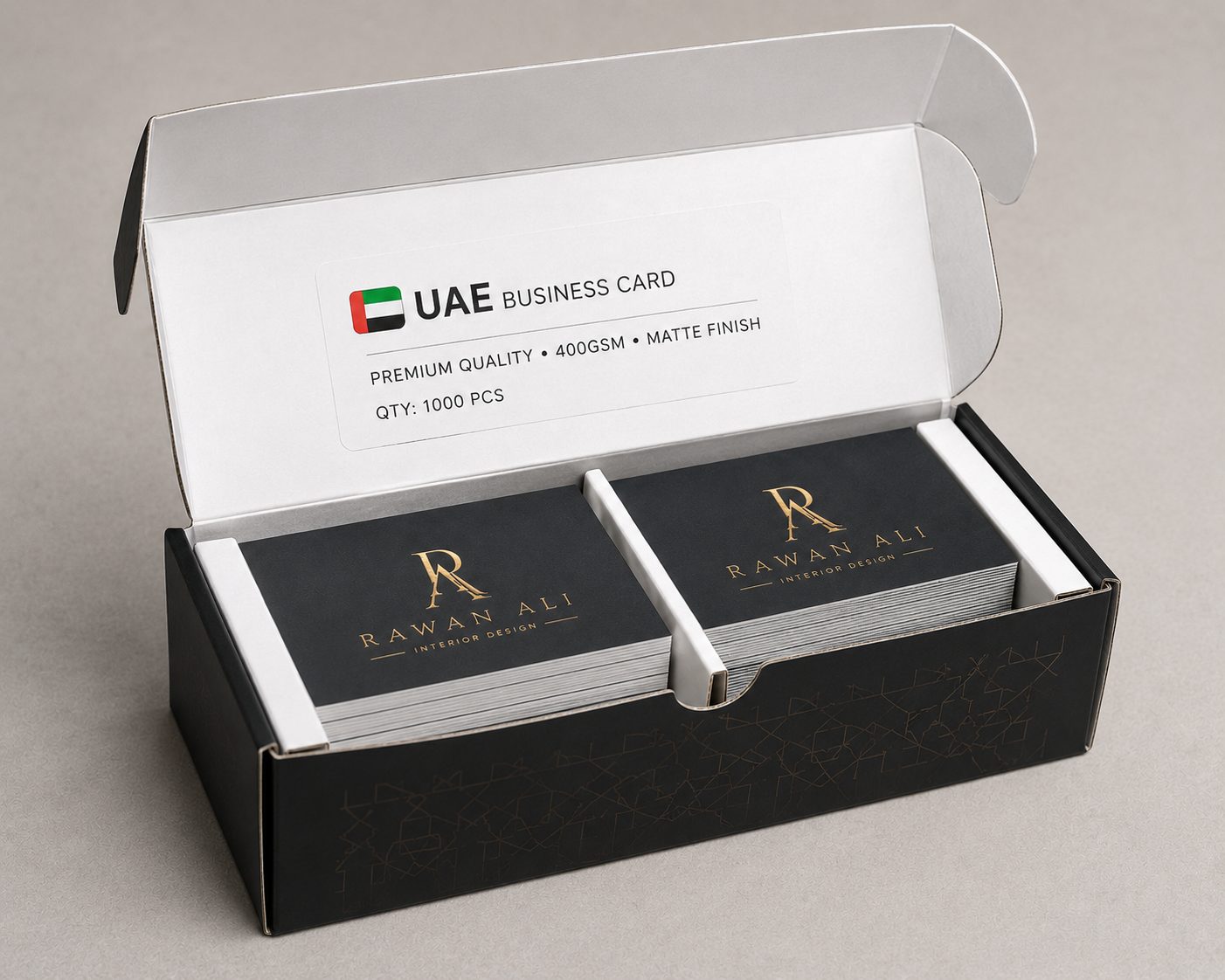 A freshly printed box of 1,000 business cards opened to reveal neat stacks, ready for delivery, with a subtle UAE Business Card label